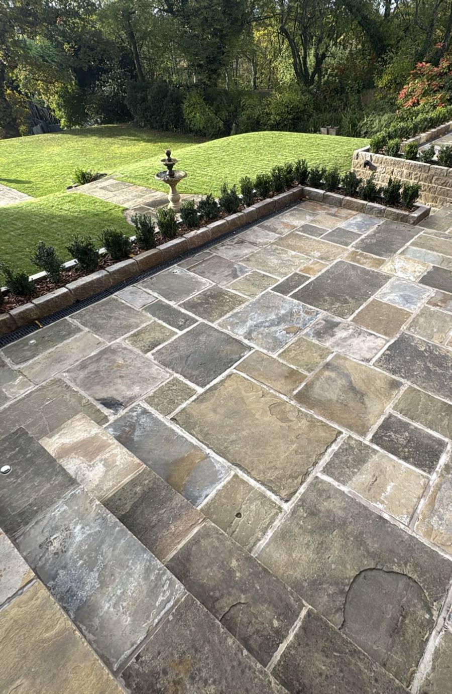 Yorkshire stone patio with steps and planters