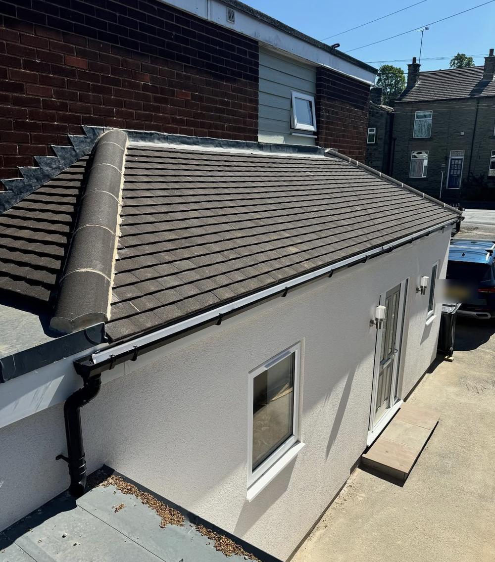 Side of the extension with a reclaimed Rosemary tile roof and rendered walls