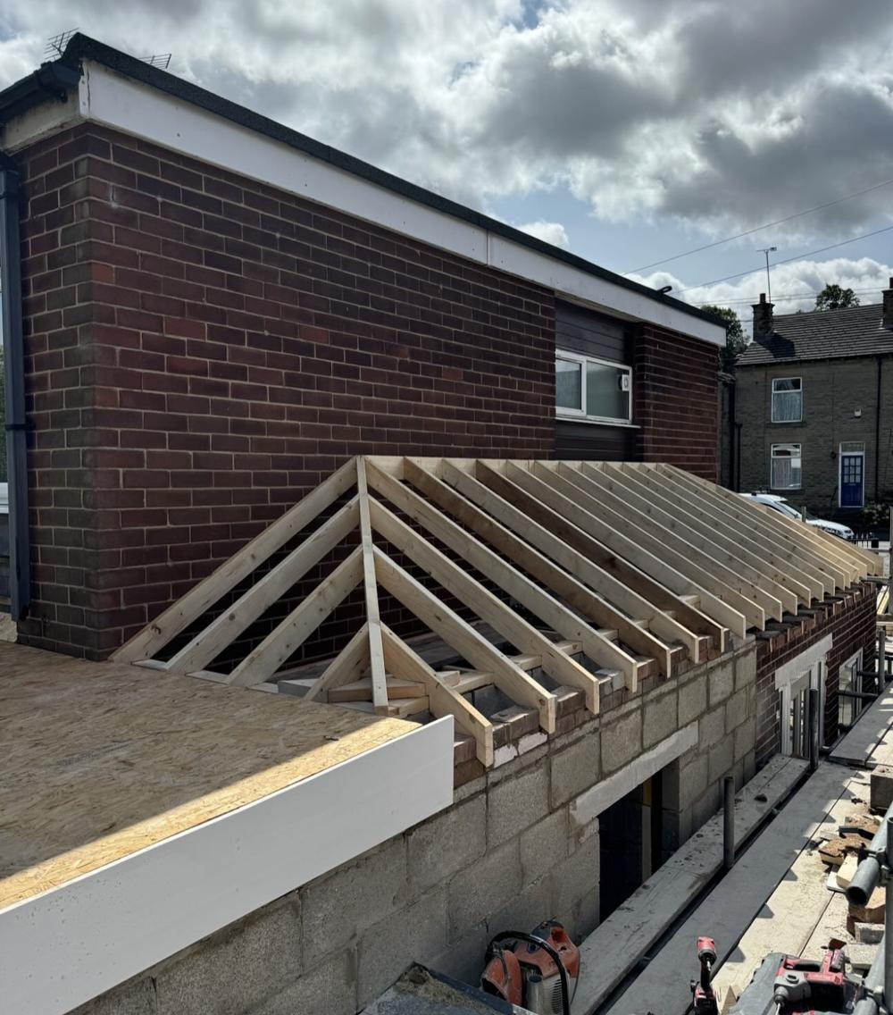 Timber roof framing going up on the extension